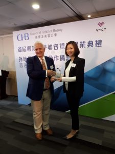 Alan Woods presenting partnership award to the CHB Chairperson Joanne Chan